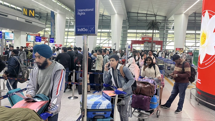 Counsellor supporting students at the airport